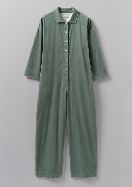 TOAST - CRINKLE COTTON JUMPSUIT  Soft, crinkled cotton double cloth with  high round neckline. Button opening at back and low drawstring waist - can  be worn low or tied. Ankle-skimming and