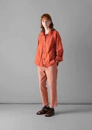 Orange shirt grey pants on sale